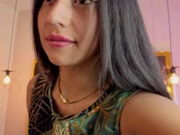 A brunette girl with soft, radiant skin, a slim body that moves with grace and energy. Her black, straight, shiny hair falls in soft waves over her shoulders, highlighting her lively face. She has a warm and contagious smile that lights up her expression and reflects her cheerful and laughing personality. Her attitude is determined and confident, always with a spark of confidence that is noticeable in her bearing and the way she interacts with others. She has a lively look that shows her enthusiasm for life, leaving an impression of freshness and positivity wherever she goes.